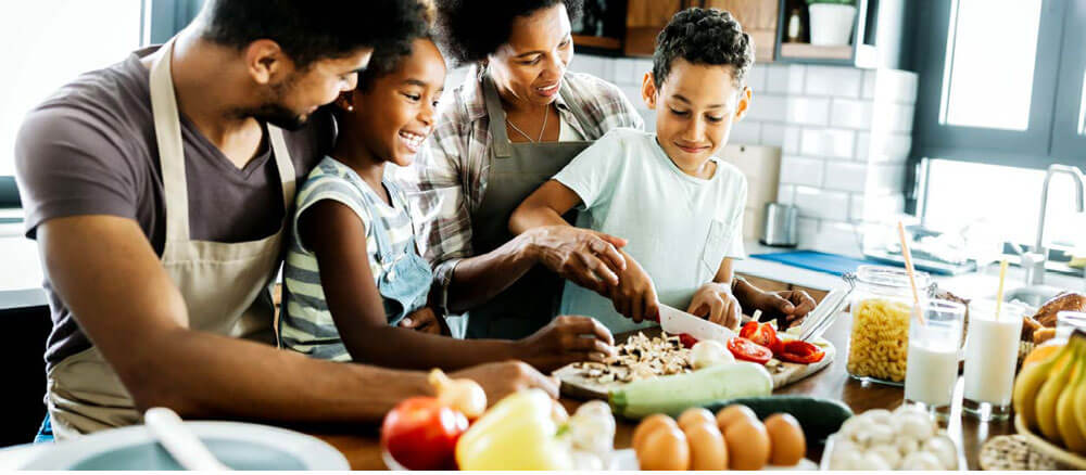 family cooking healthy food together