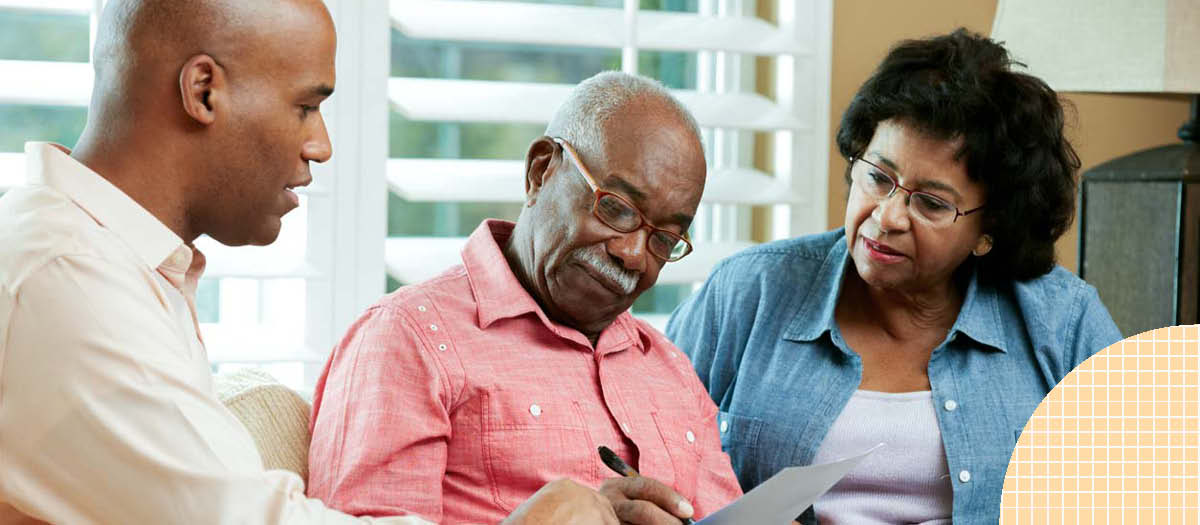 Senior couple reviewing insurance and retirement documents