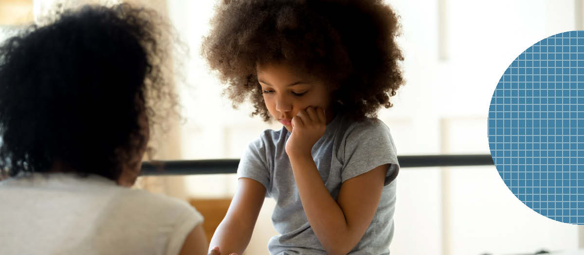 Young girl holding her sore mouth