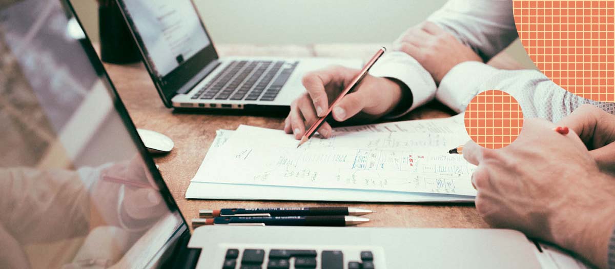 Two people looking over written notes