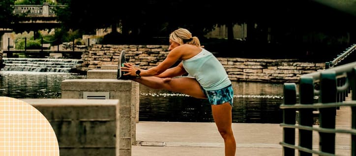 Woman stretching in stadium