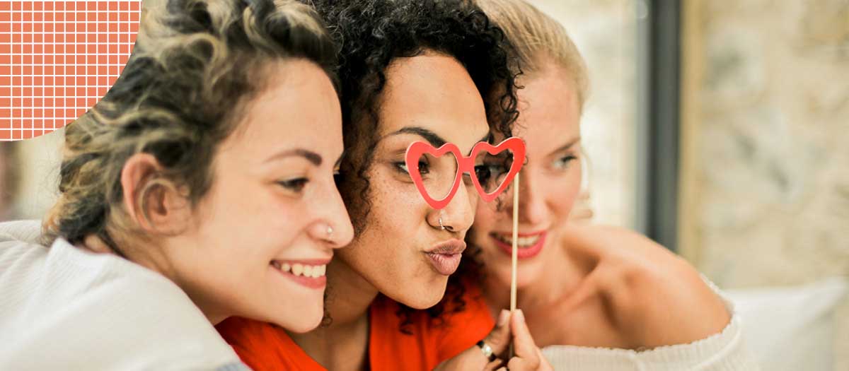 Three girls posing for a photo closely