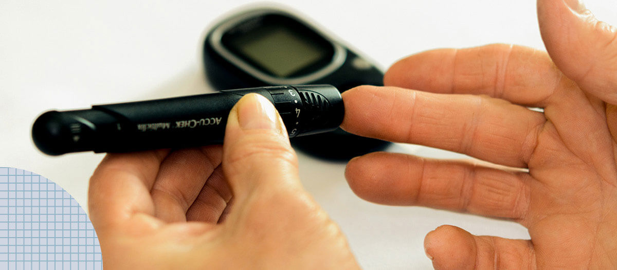 Person checking blood sugar with meter