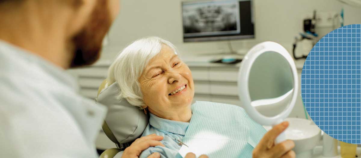 Senior woman in dental chair smiling