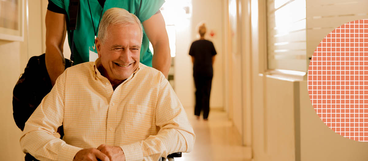 Pushing a senior man in wheelchair