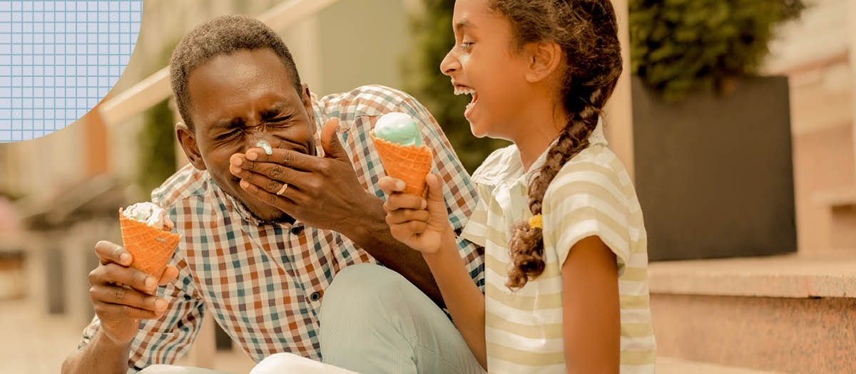 Man and daughter eating ice cream