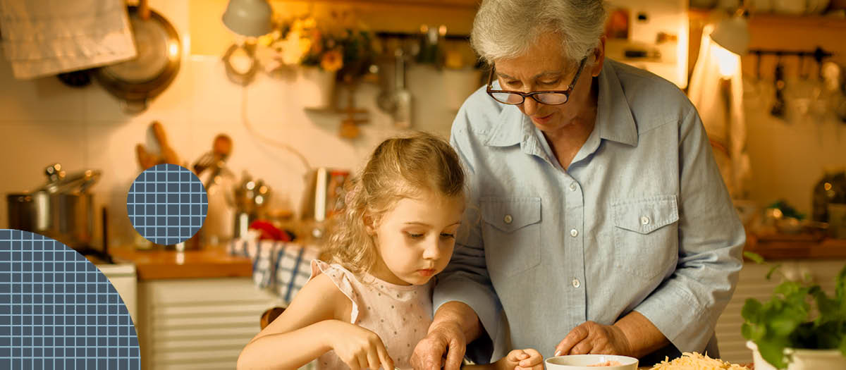 Grandma and granddaughter making snacks in the kitchen