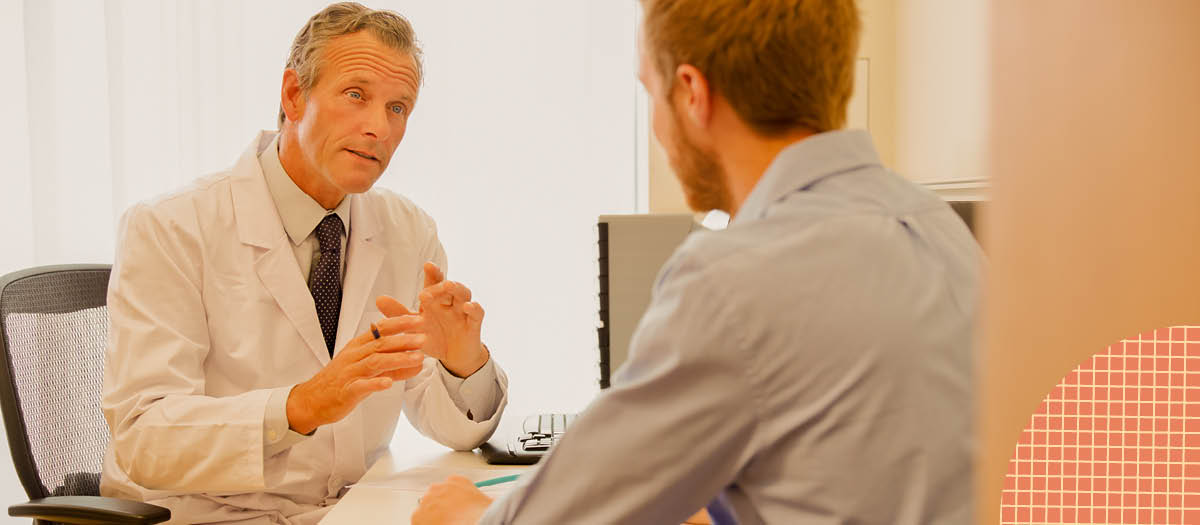 Male doctor talking to patient 