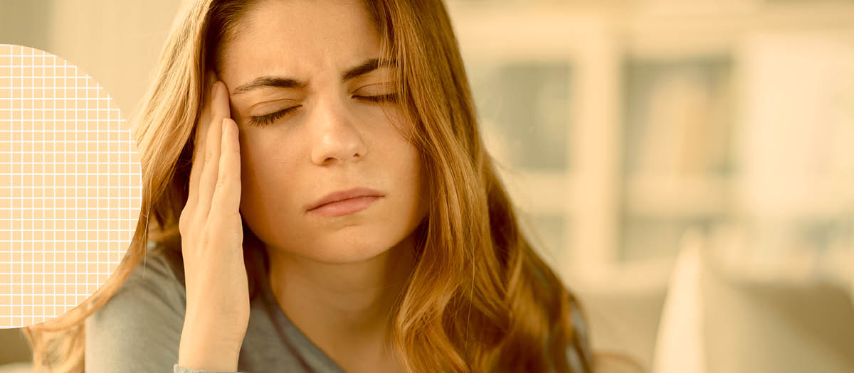 Woman rubbing her jaw in pain