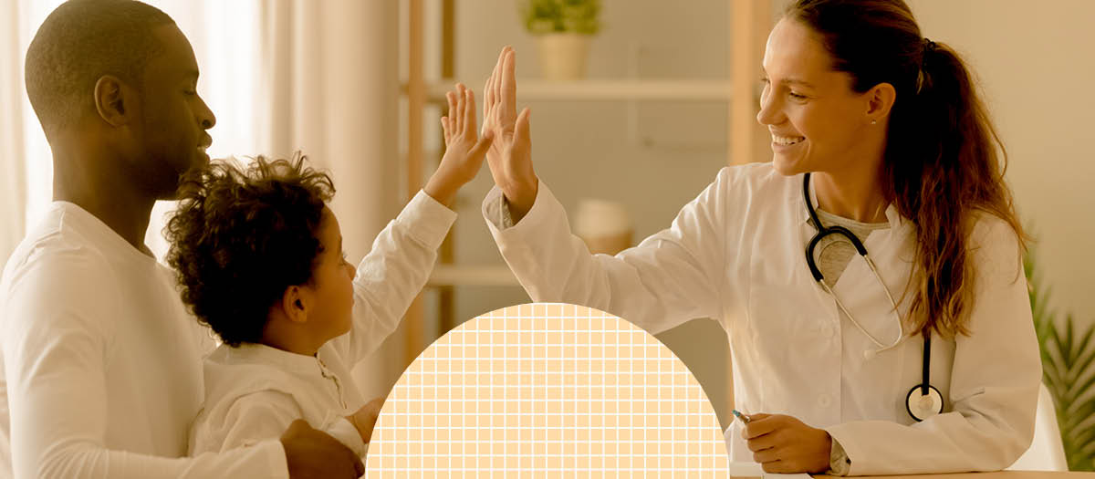 Dad and son hi-fiving dentist