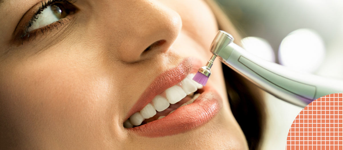 Woman getting professional teeth cleaning at dentist