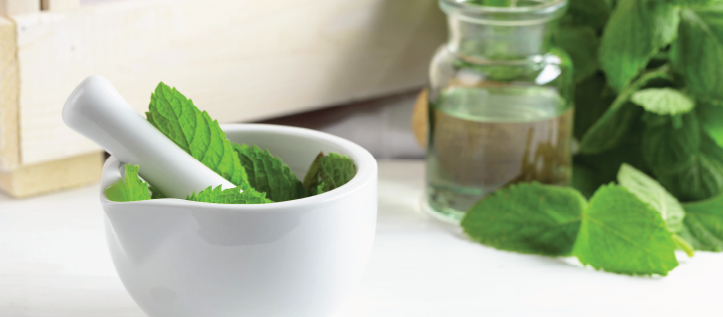 A bowl of mint ready to be crushed for soothing a toothache