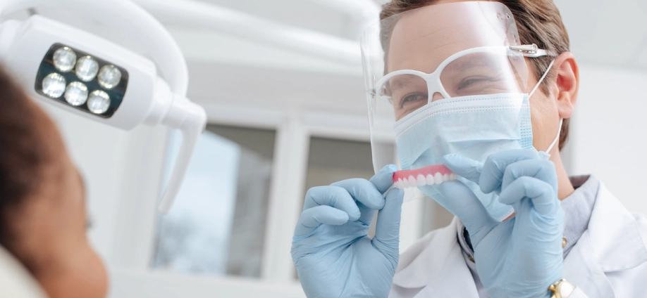 Dentist smiling at his patient