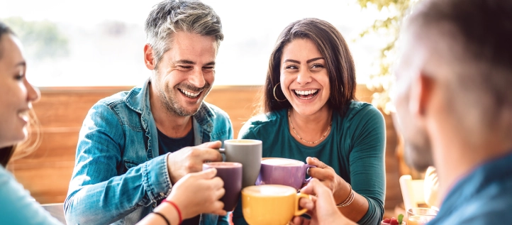 Group of friends smiling about cheap dental plans