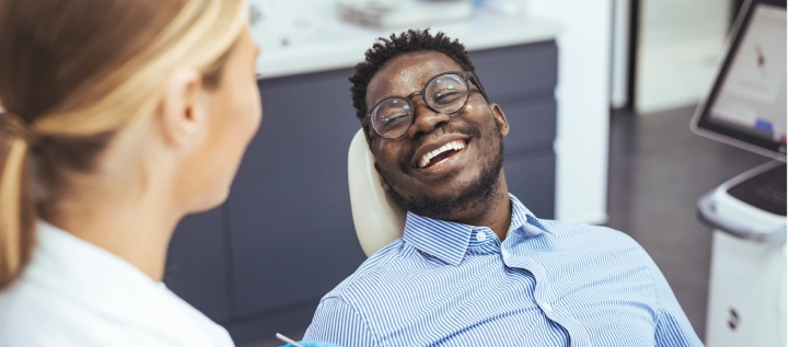 Middle age man at the dentist smiling