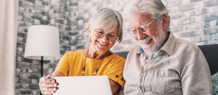 An older couple researching affordable dental care on Spirit Dentals website