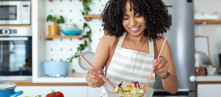 Woman preparing a salad in the kitchen