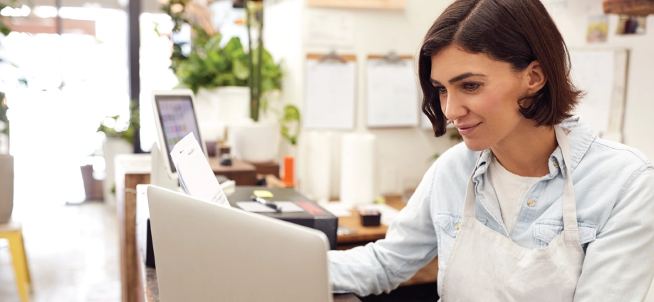 Female business owner shopping for small business dental insurance