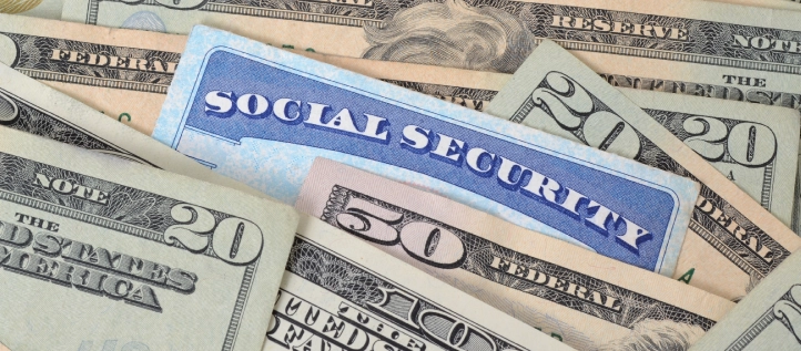 Social security card surrounded by money